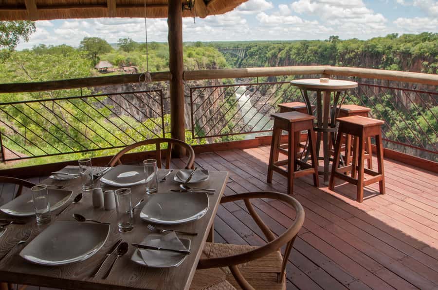 Victoria Falls Safari with Lunch and Sunset Cruise - Victoria Falls at 11:00 AM, rainforest walking, and the cliffs across the Batoka Gorge